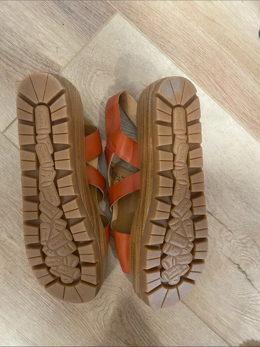Women’s Korks platform wedge sandals feature a cork sole slingback buckle.
